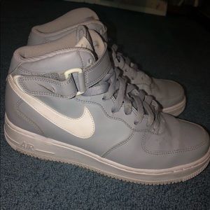 Grey and white high top air force ones